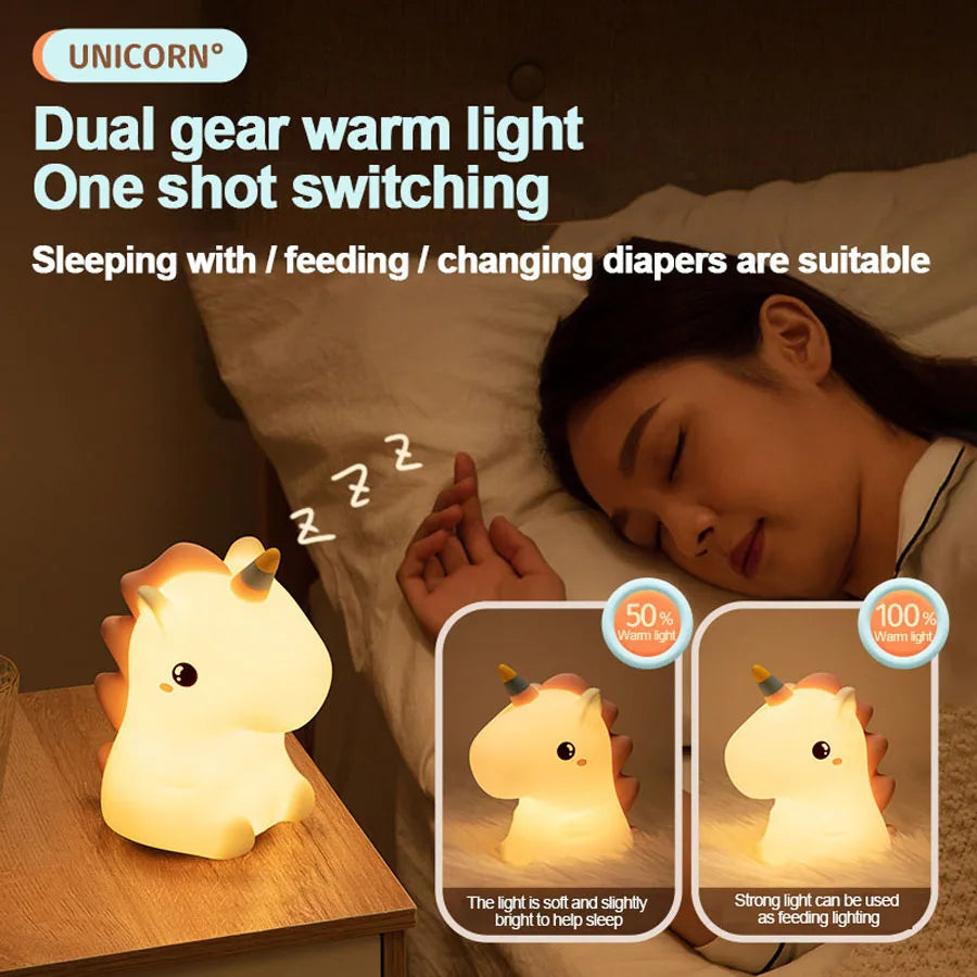Unicorn LED night light on bedside table, warm glow with orange mane and horn