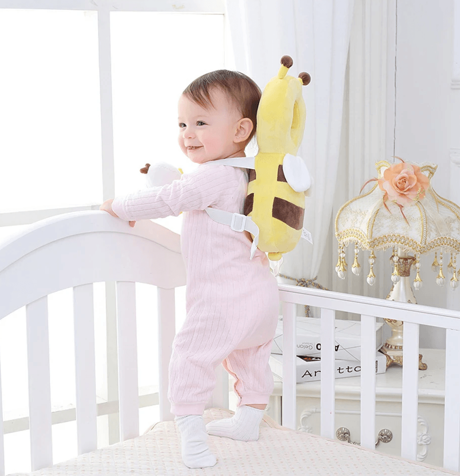 Bee-shaped head protection cushion, yellow plush with brown and white accents