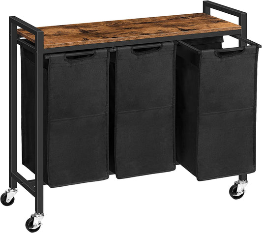 3-bin laundry sorter cart with black fabric bags and rustic wooden top on caster wheels.