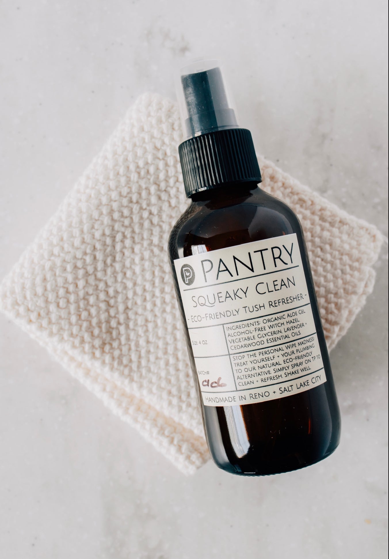 Eco-friendly toilet paper spray bottle with black mist nozzle and label