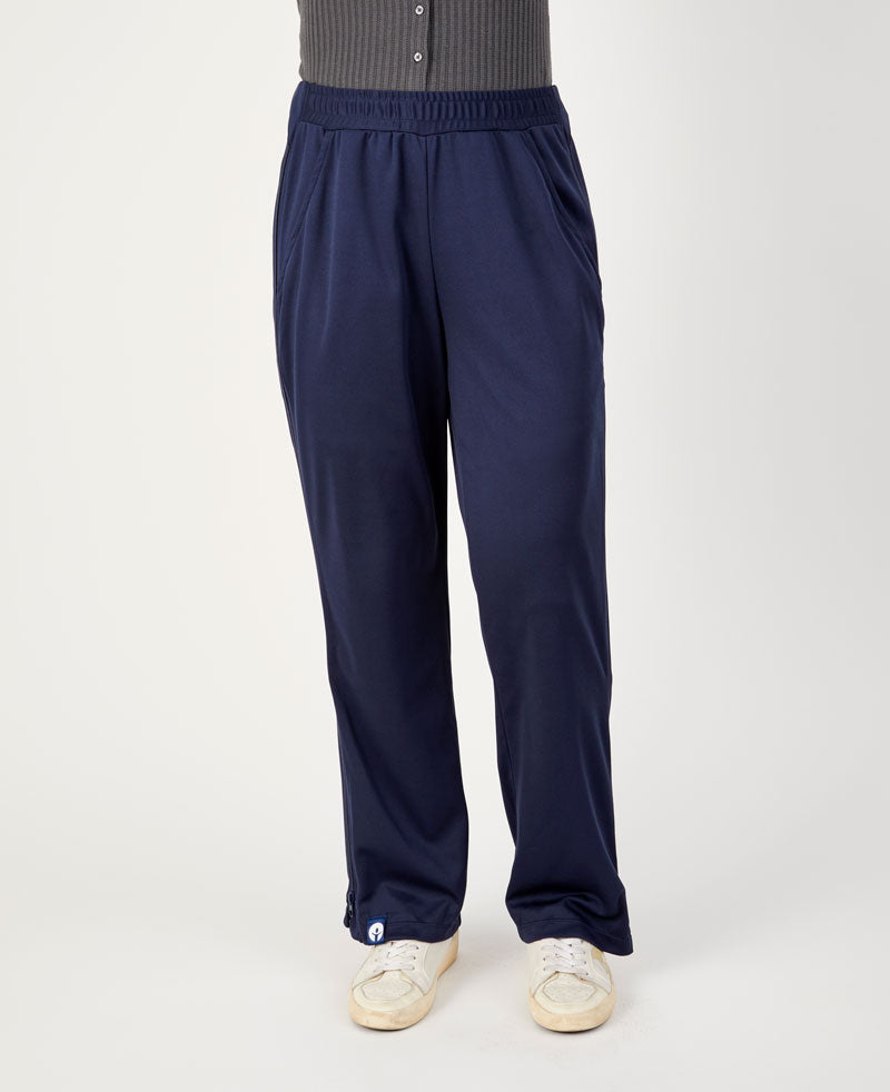 Navy blue pants worn by a person on a white background