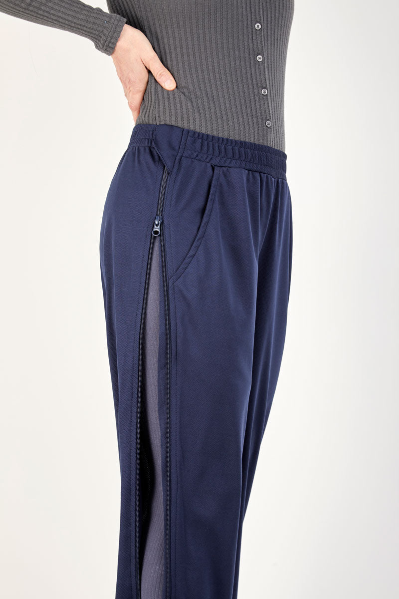 Navy blue pants with a zipper on a white background