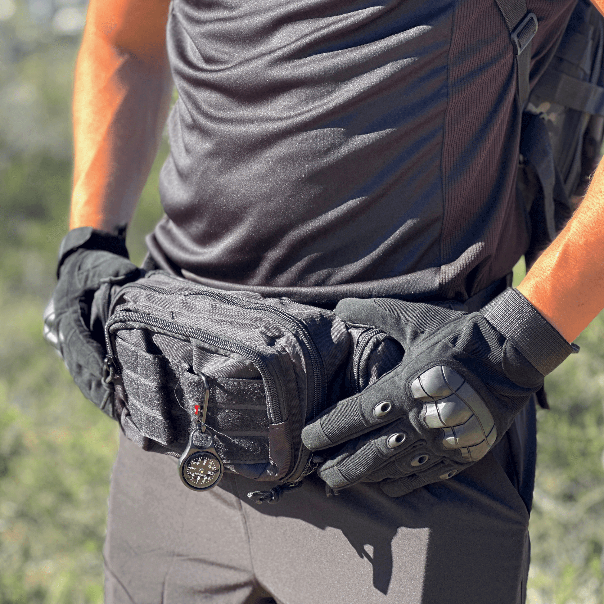 Black protective gloves with molded knuckle armor and textured palm grip