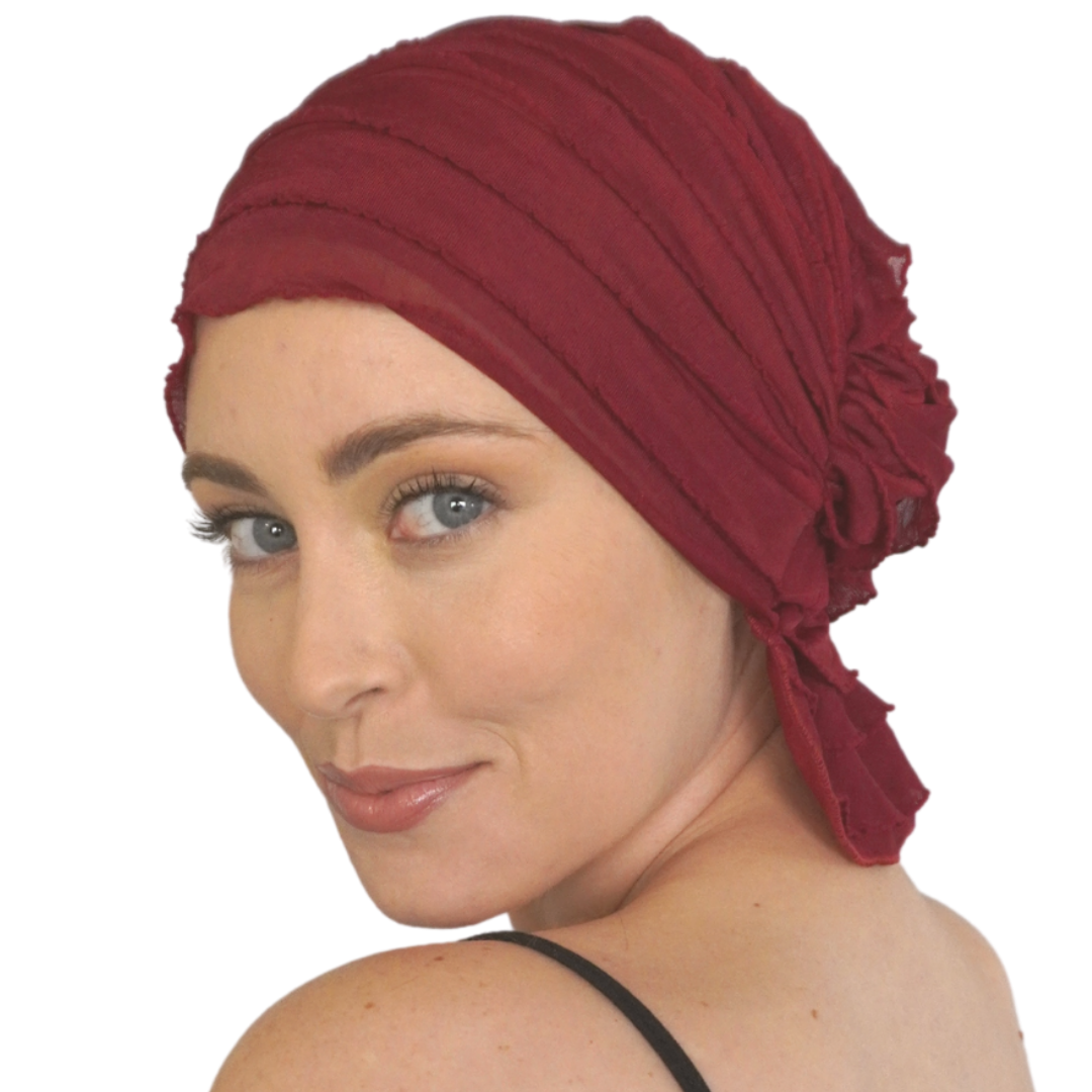 Burgundy turban-style chemo headscarf with soft draped fabric