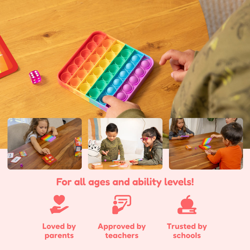 Rainbow pop-it fidget mats and learning cards used at a tabletop by children