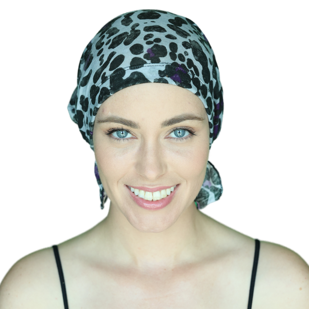 KATY CHEMOBEANIES® chemo beanie with dark leopard print and purple accents, front view