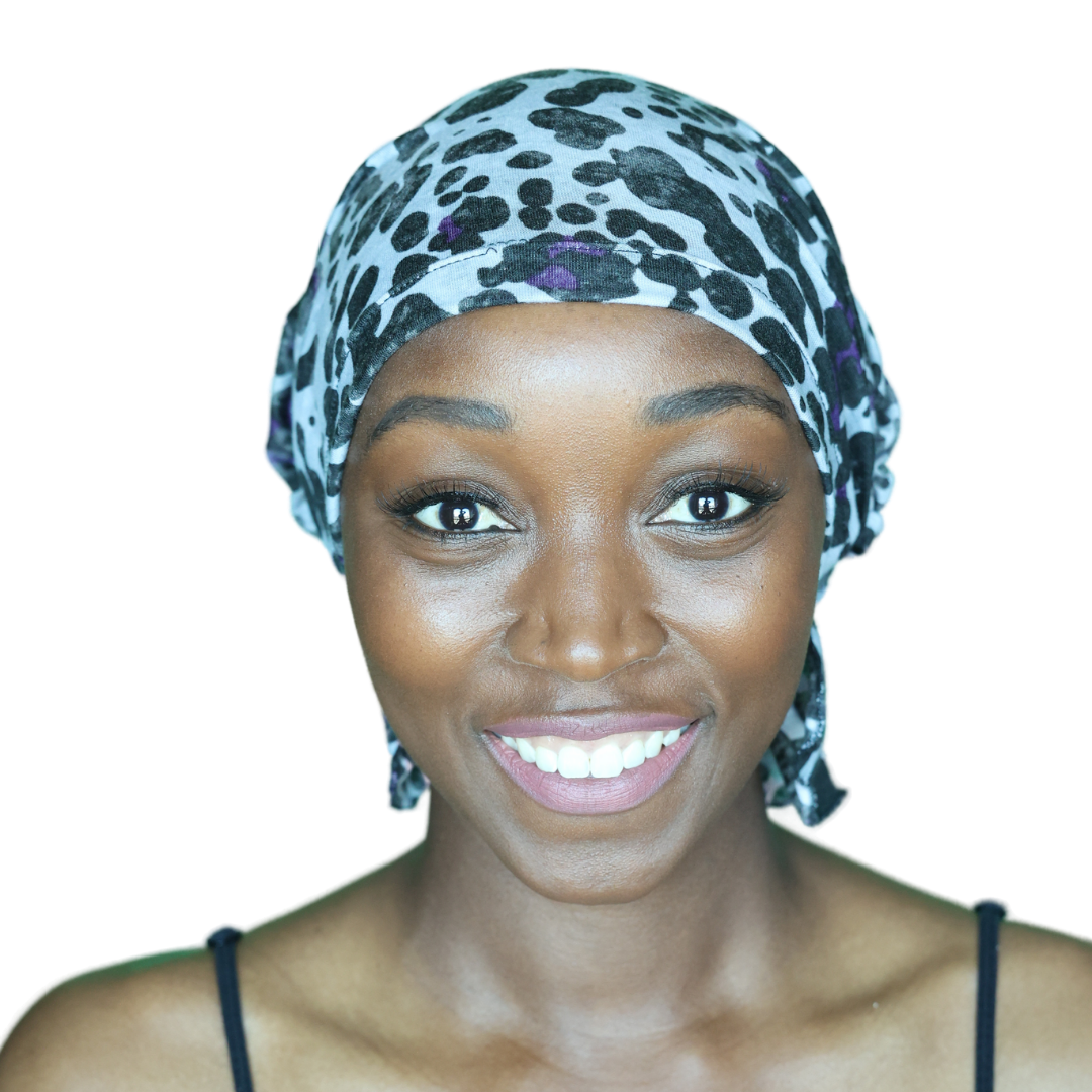 KATY CHEMOBEANIES® chemo beanie with leopard print in teal and purple, front smile