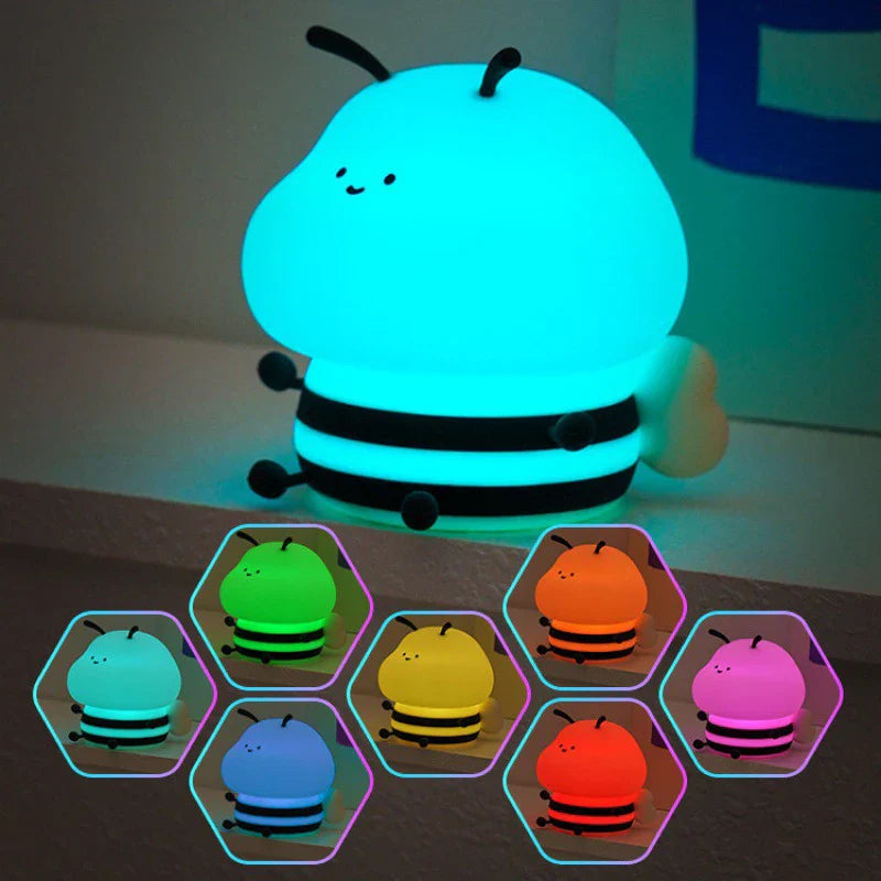 Bee-shaped night light glowing blue with stacked black rings; shows multiple color options below