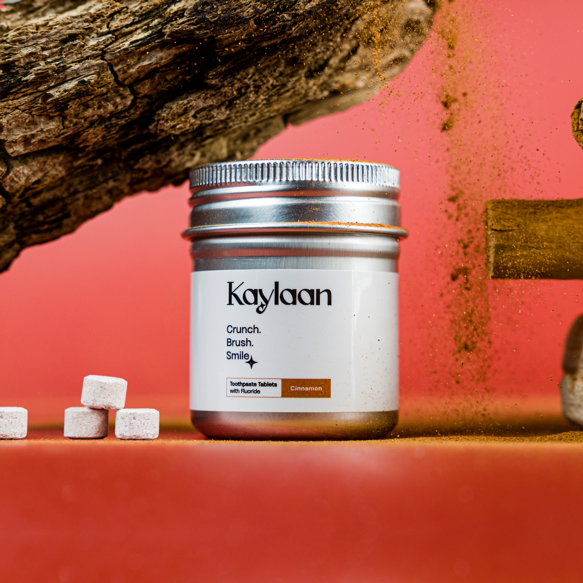 Fluoride cinnamon toothpaste tablets jar with Kaylan label and small tablet pieces
