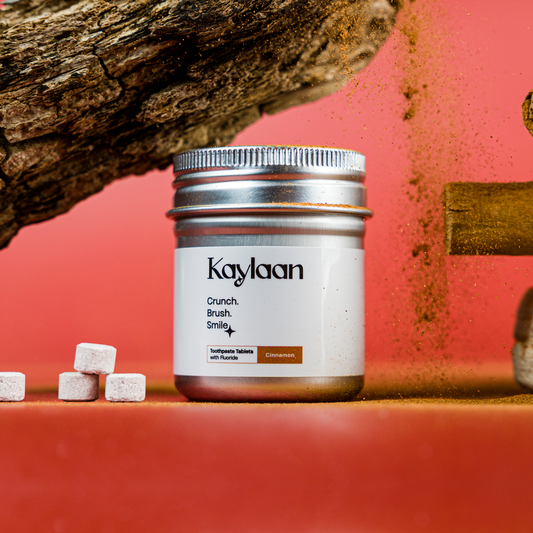 Fluoride cinnamon toothpaste tablets jar with Kaylan label and small tablet pieces