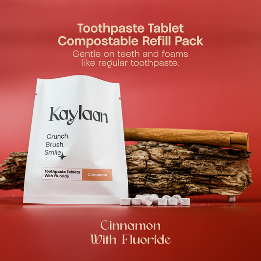 Cinnamon with fluoride toothpaste tablet refill pack with tablets on surface.