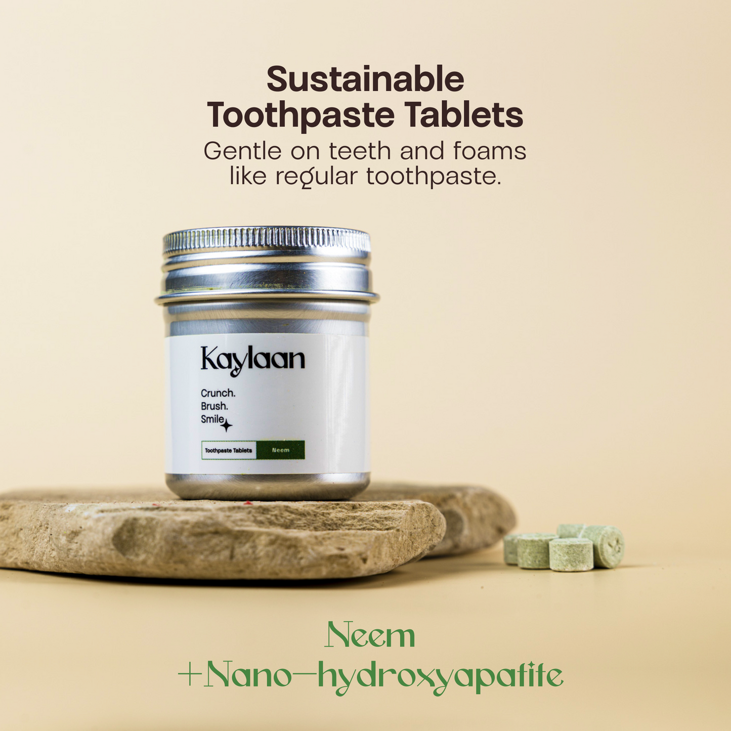 Toothpaste tablets jar with silver lid and Neem green label on stone