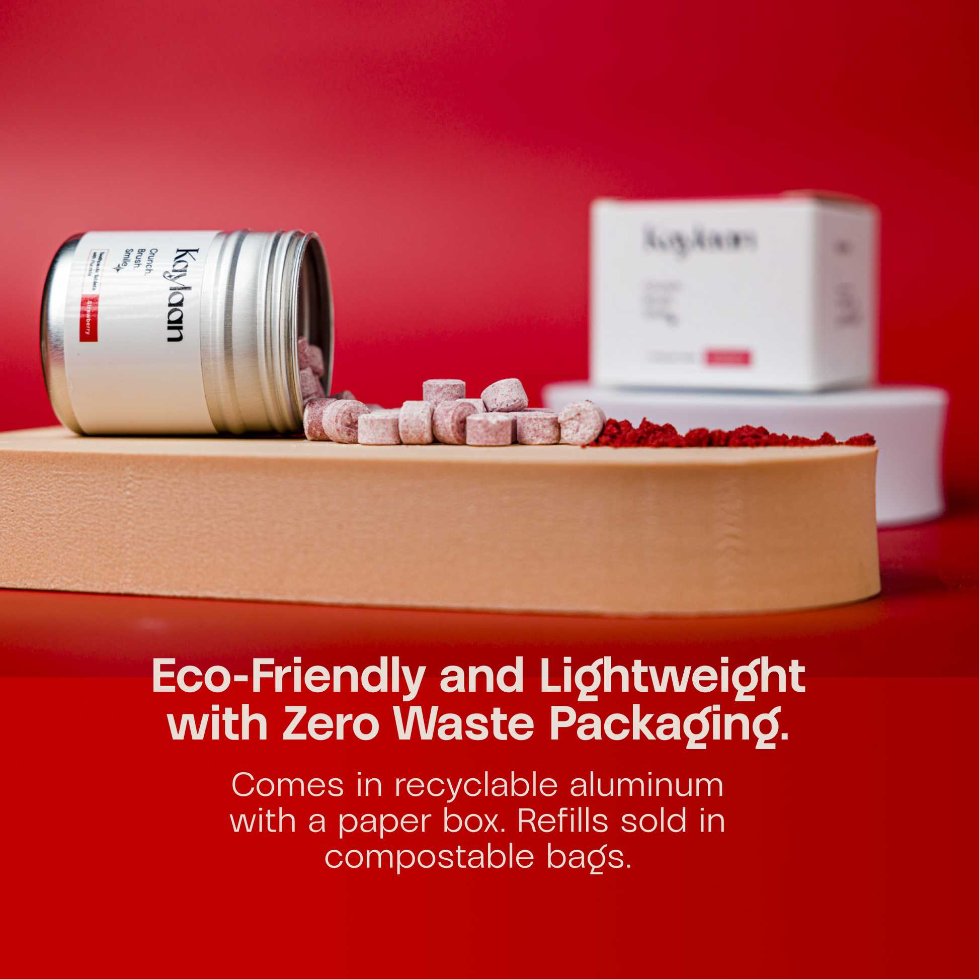 Non-fluoride strawberry toothpaste tablets jar with scattered tablets and paper box