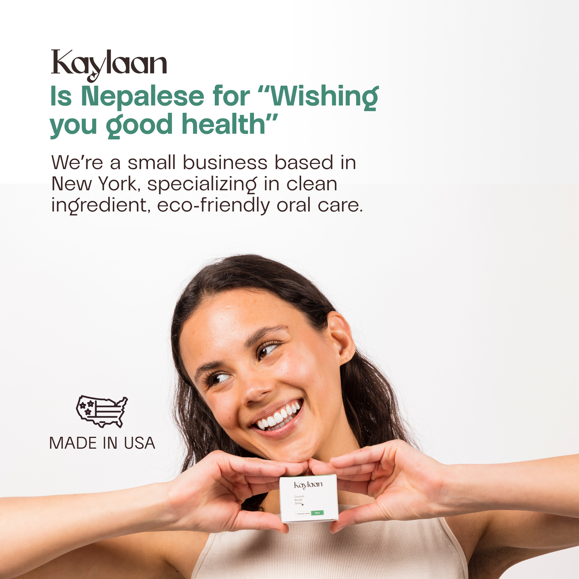 Smiling person holding Kaylaan trial pack; fluoride toothpaste tablets for oral care