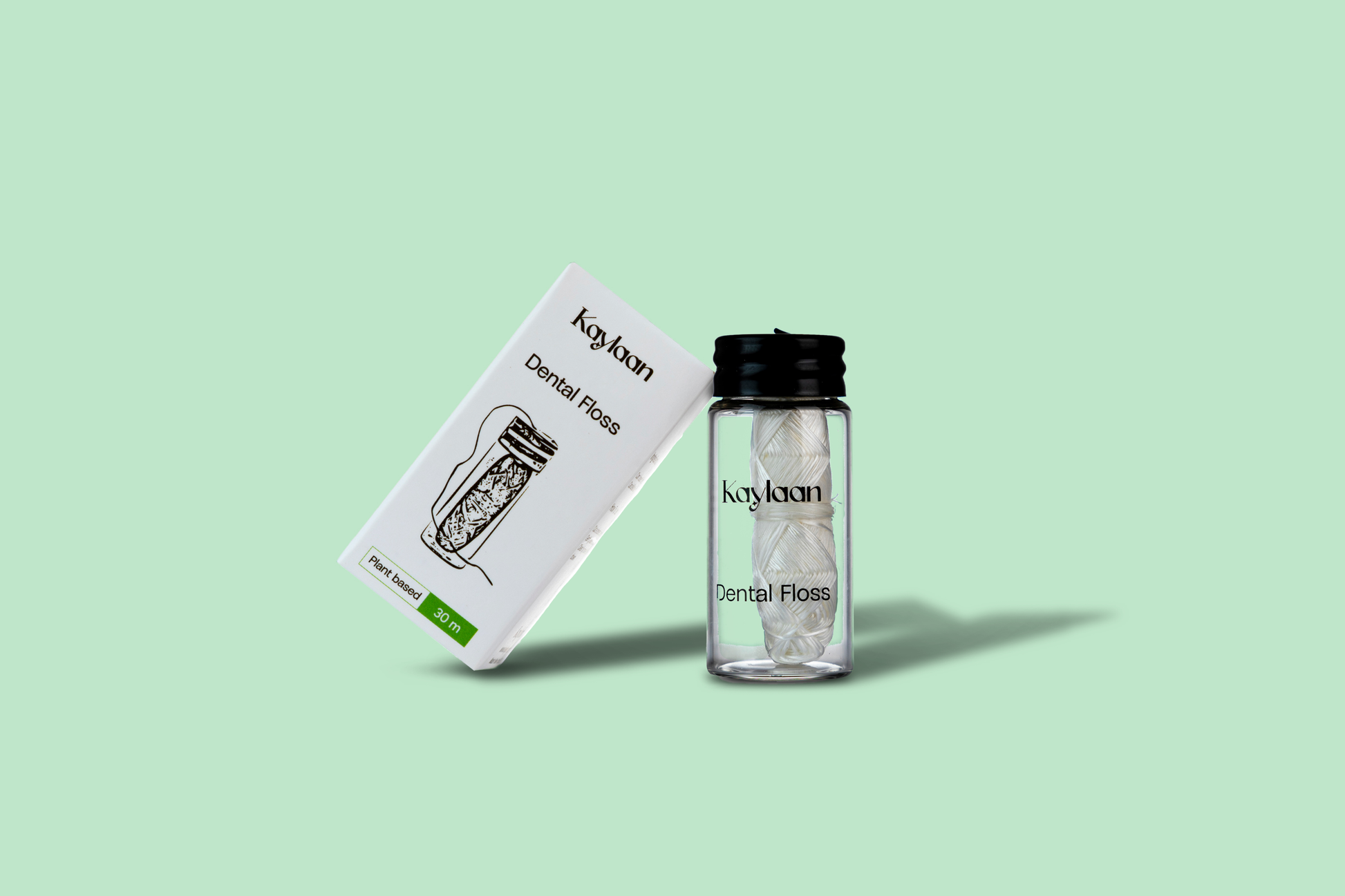 Dental floss set with Kaylan bottle and box, with black cap and white floss