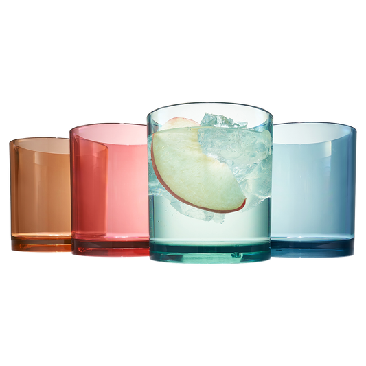 Acrylic lowball glasses with ice, in amber, red, green, and blue translucent tones
