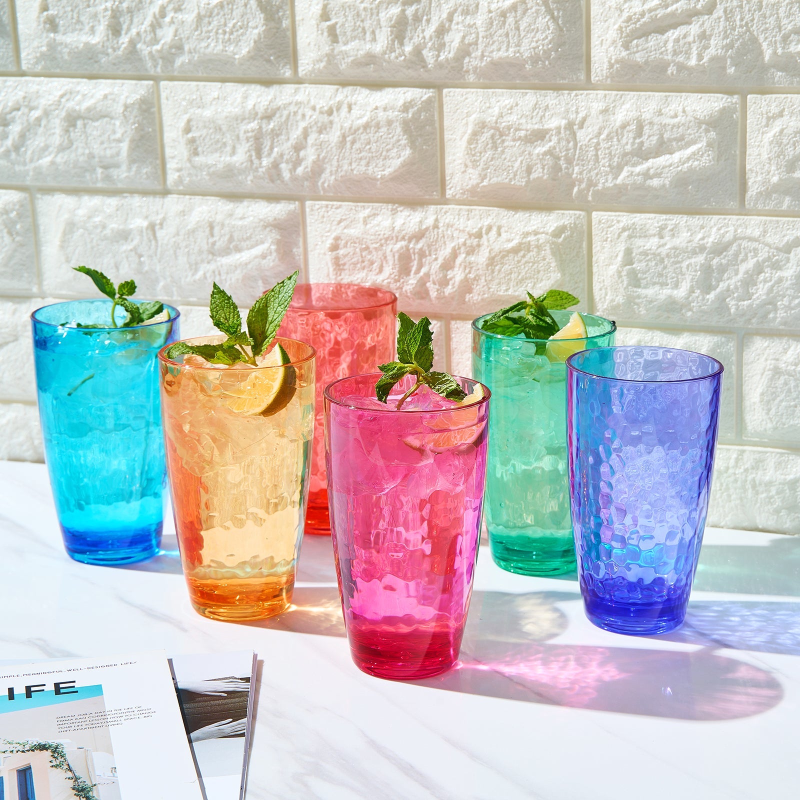 Set of 6 colored acrylic highball glasses with ice, mint, and citrus on top