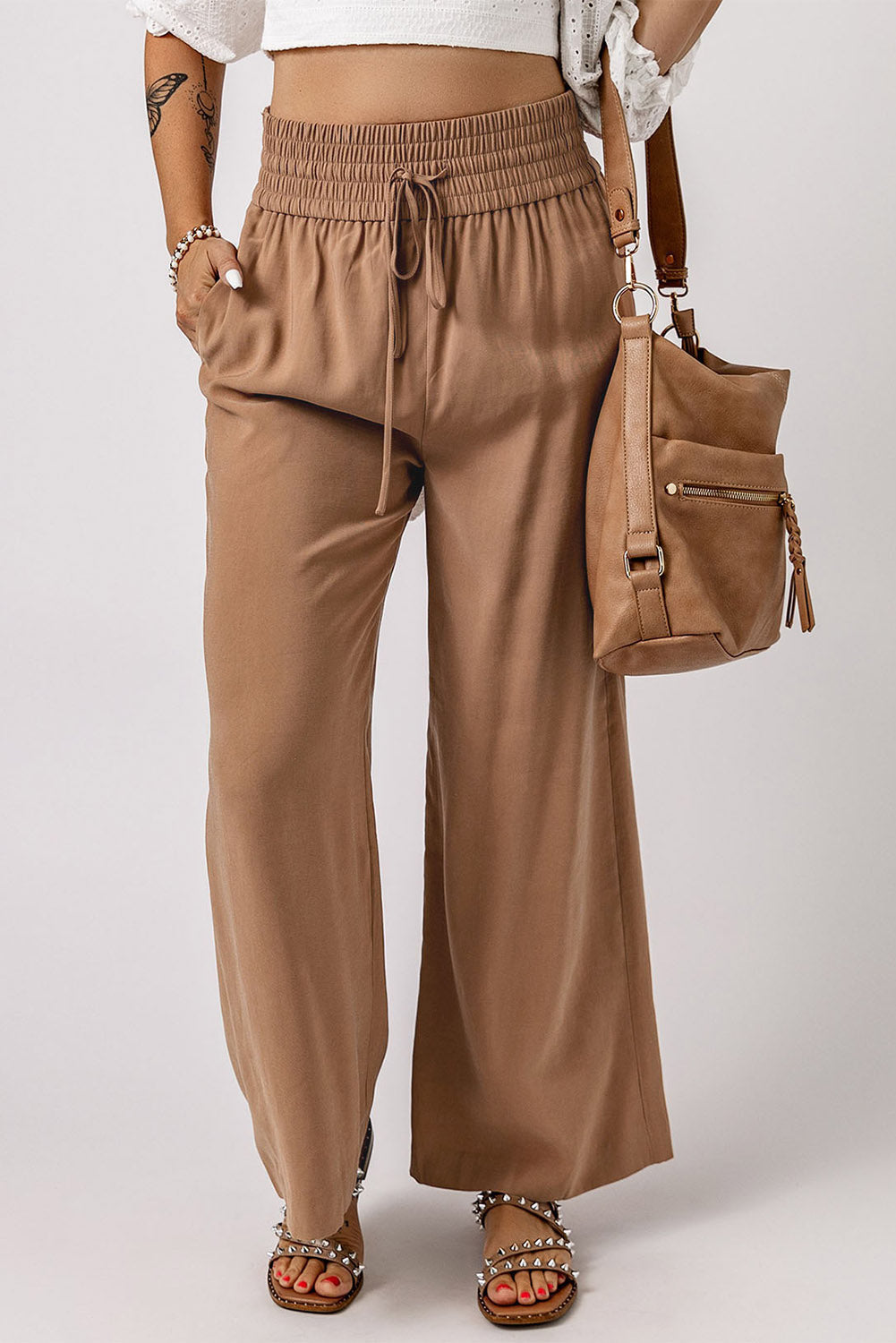 Tan wide-leg casual pants with elastic waistband and drawstring tie