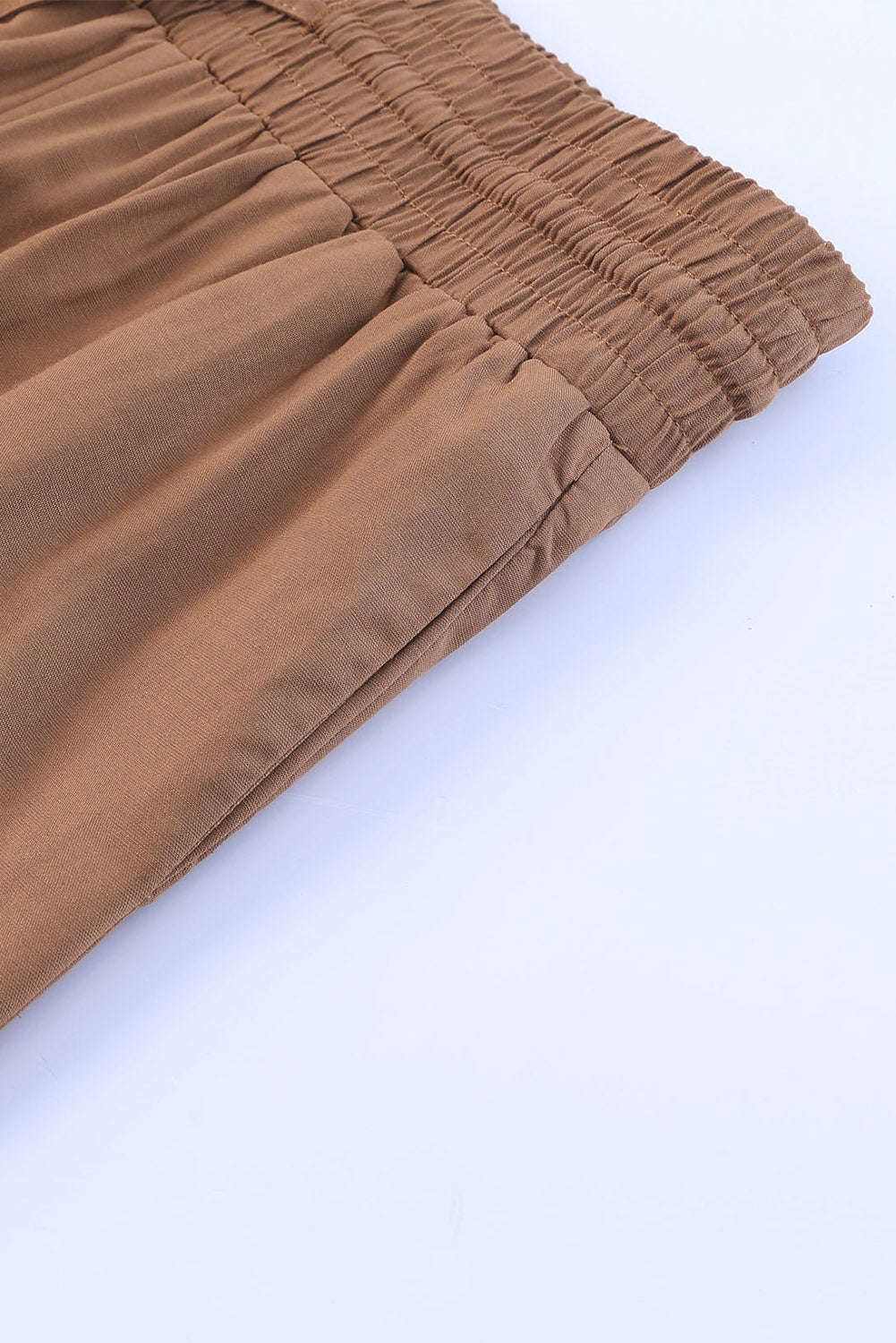 Tan wide-leg pants fabric with elastic waistband and gathered seam