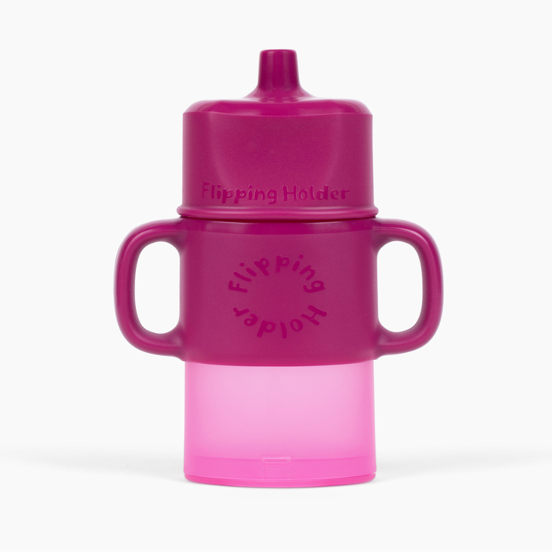 Pink toddler sippy cup with flip top and side handles