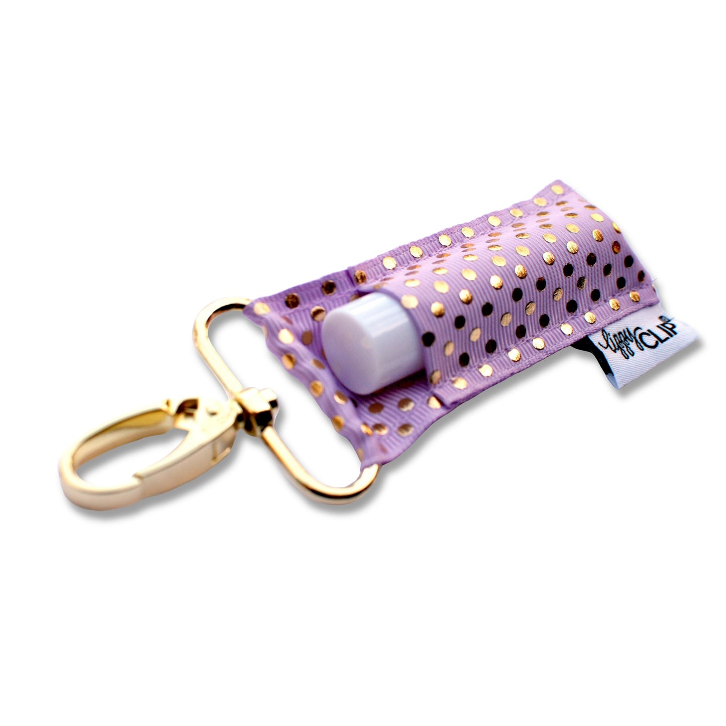 Purple keychain with gold polka dots and a white object inside on a white background