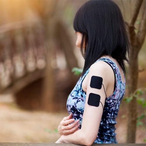Electrode pads placed on upper arm with cable connection