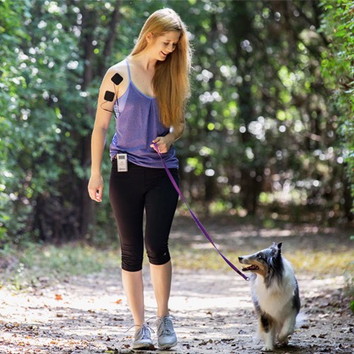 Electrode pads with cable on upper arm during outdoor activity