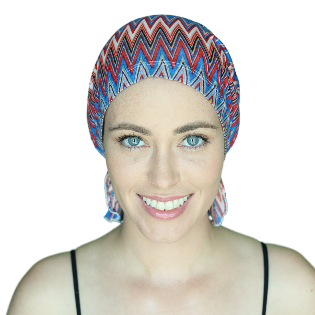 Chevron knit beanie with blue, red, and white zigzags, covering forehead