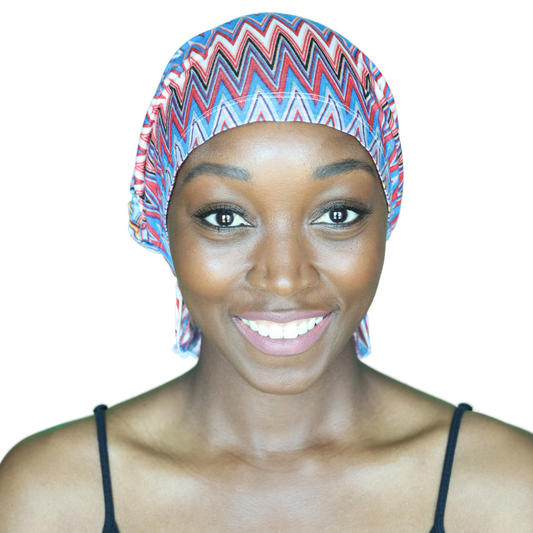 Chevron knit beanie with blue, red, and white zigzags, snug fit on head