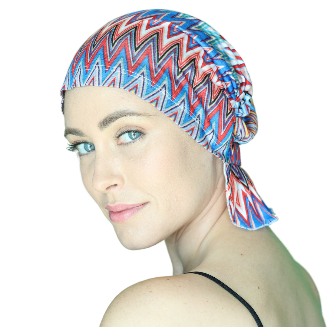 Chevron knit beanie with blue, red, and white zigzags, close-up side coverage
