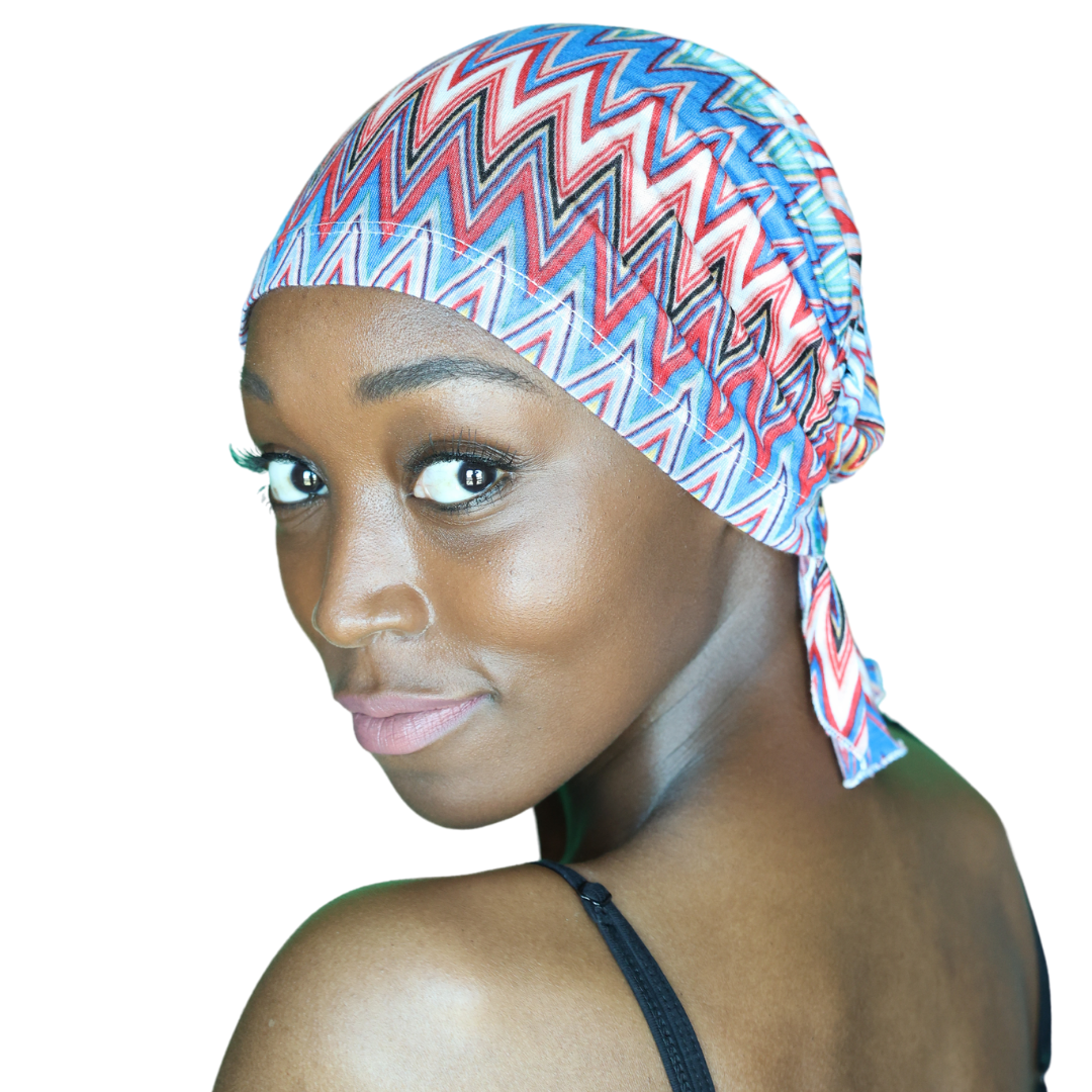 Chevron knit beanie with blue, red, and white zigzags and folded brim