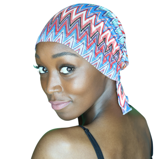 Chevron knit beanie with blue, red, and white zigzags and folded brim