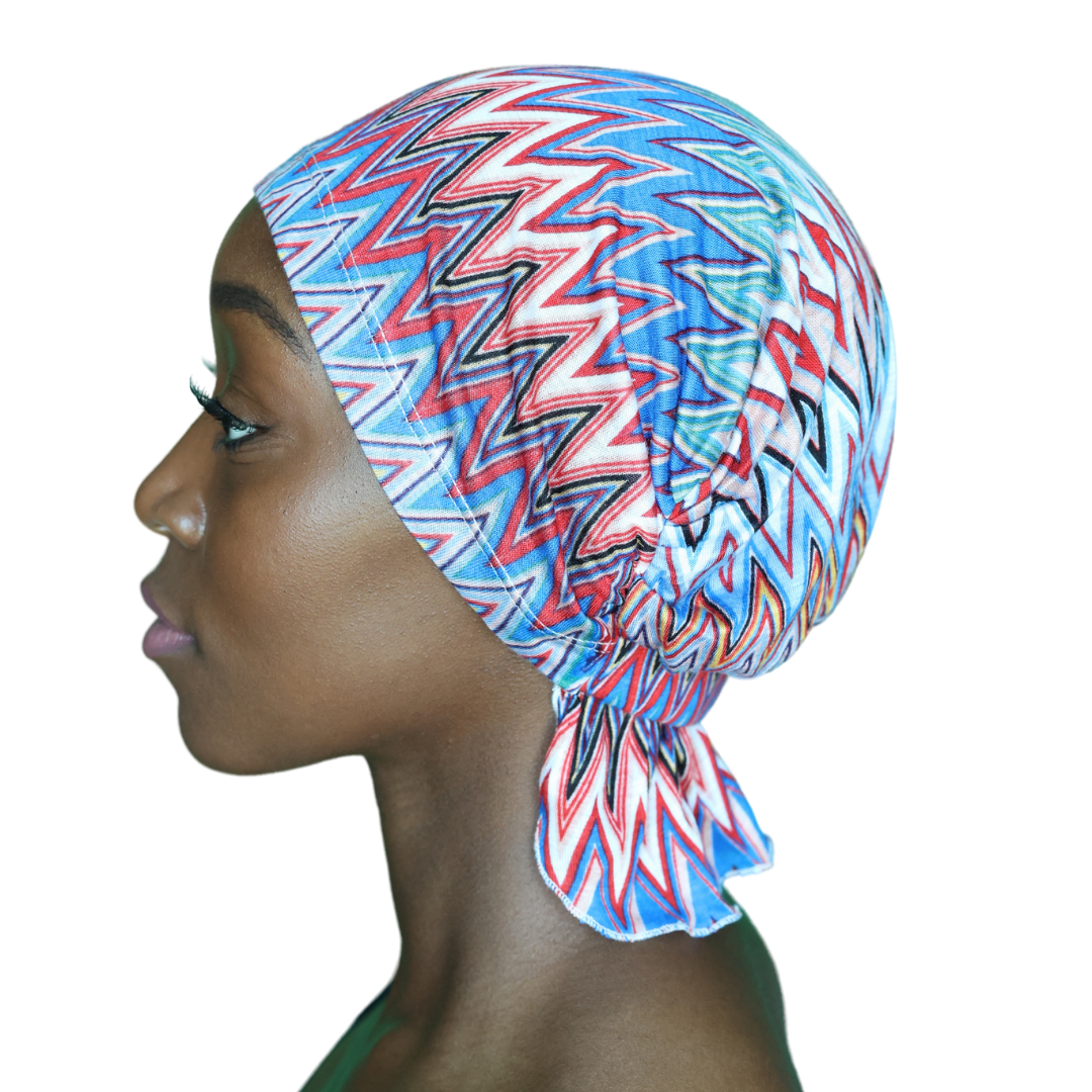 Chevron knit beanie with blue, red, and white zigzags, side profile view