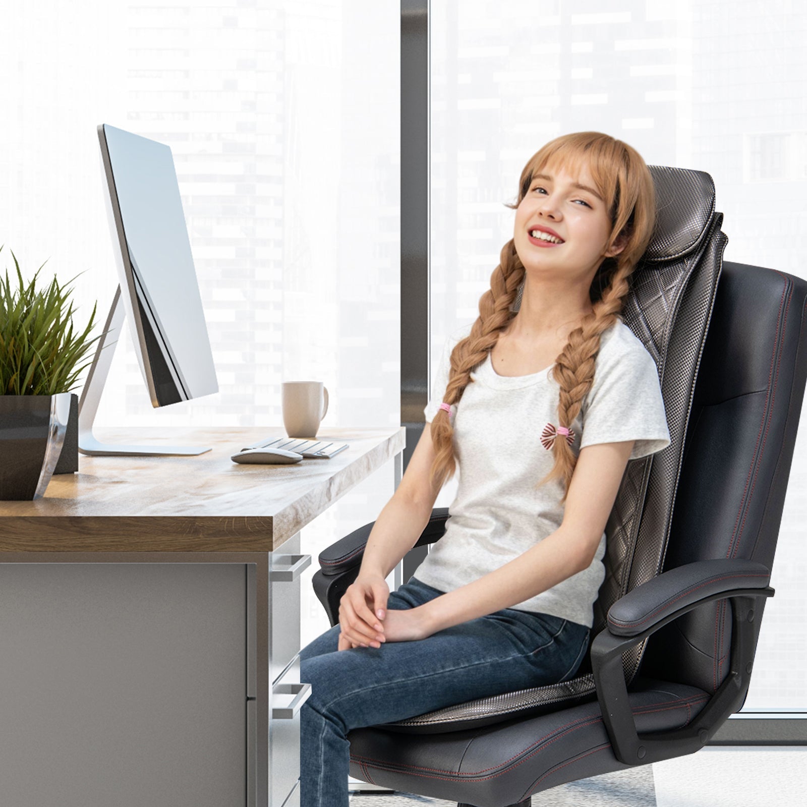 Woman sitting in a massage chair in an office setting with a desk and computer.