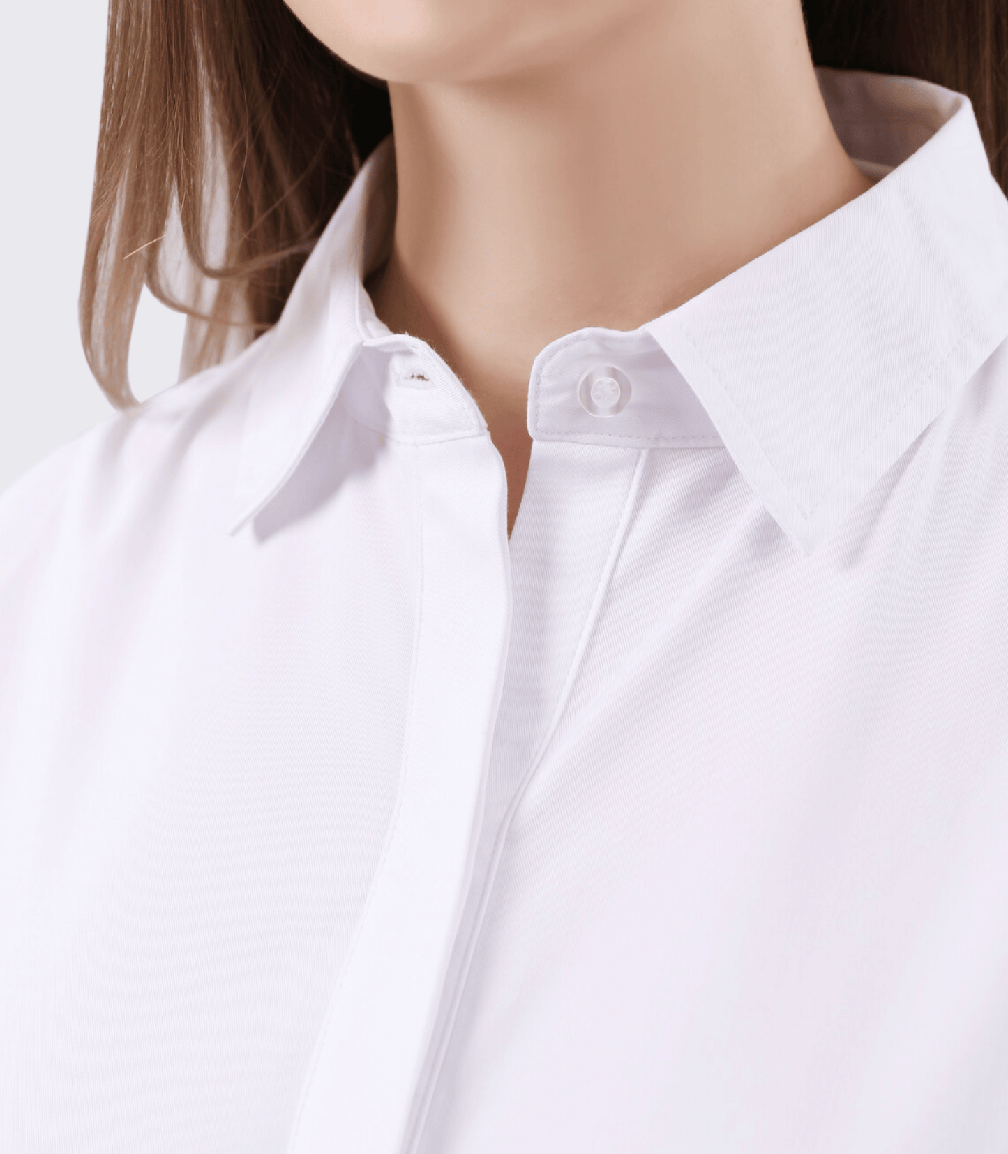 Close-up of a white shirt with a blurred background