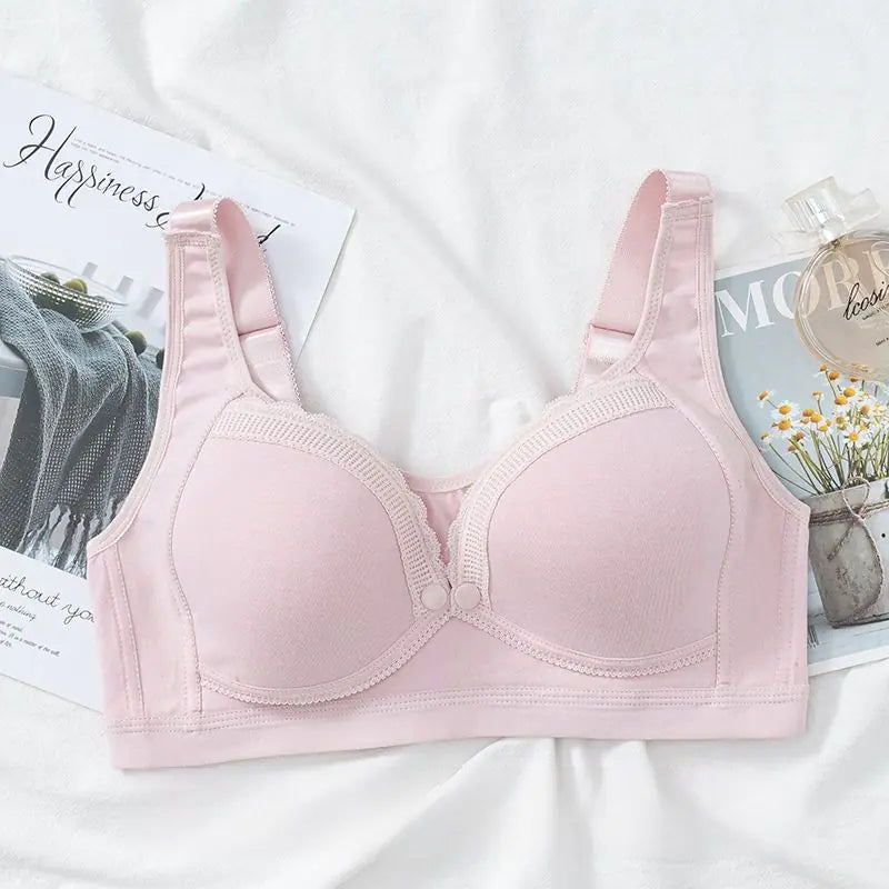 Pink front-buckle nursing bra with molded cups and adjustable shoulder straps