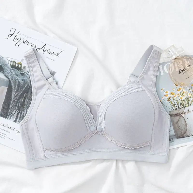 Grey front-buckle nursing bra with molded cups and adjustable shoulder straps