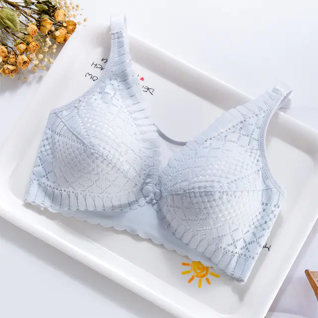 Light blue maternity nursing bra with textured lace cups and front snap closure