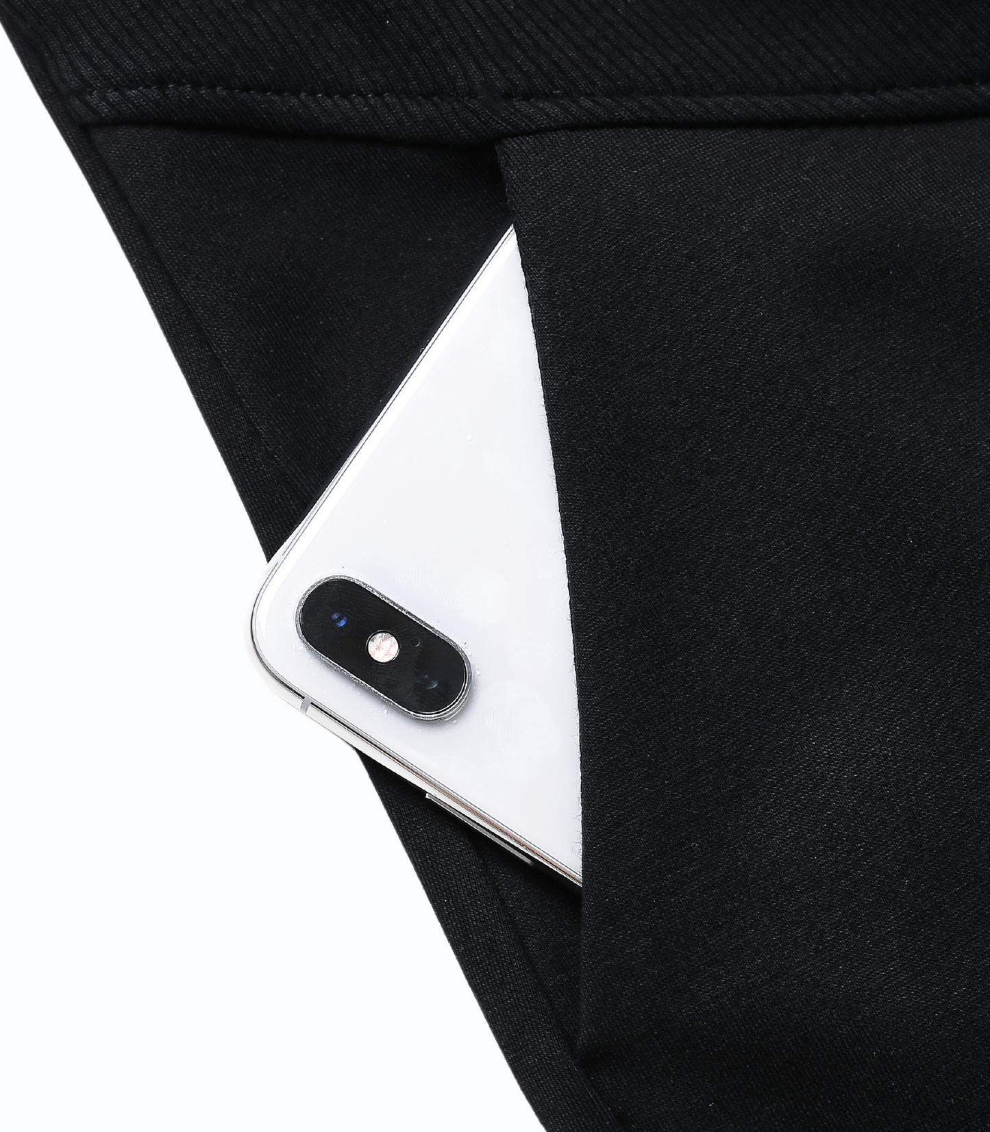 White smartphone peeking out from a black pocket