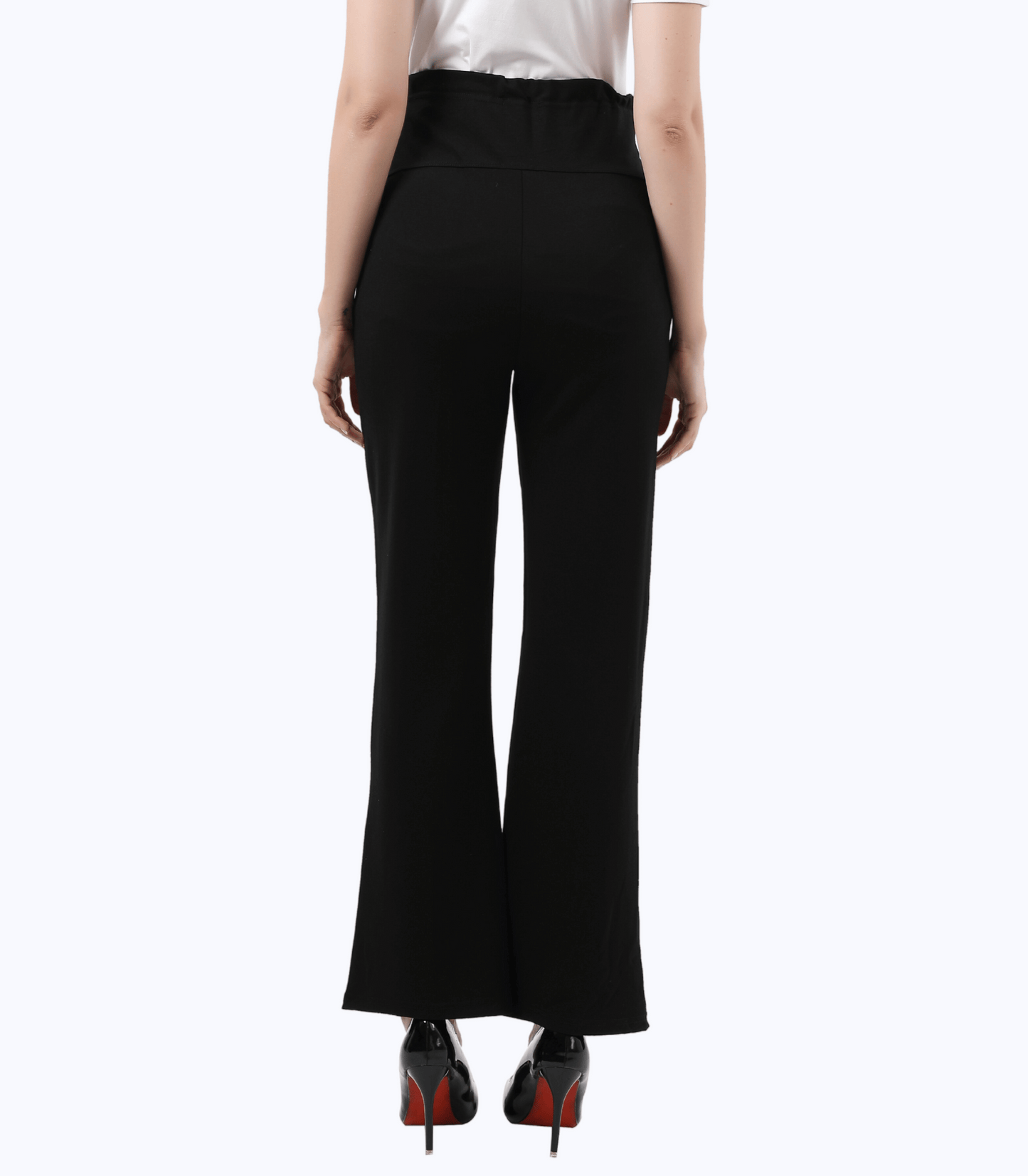 Black pants worn by a person on a white background