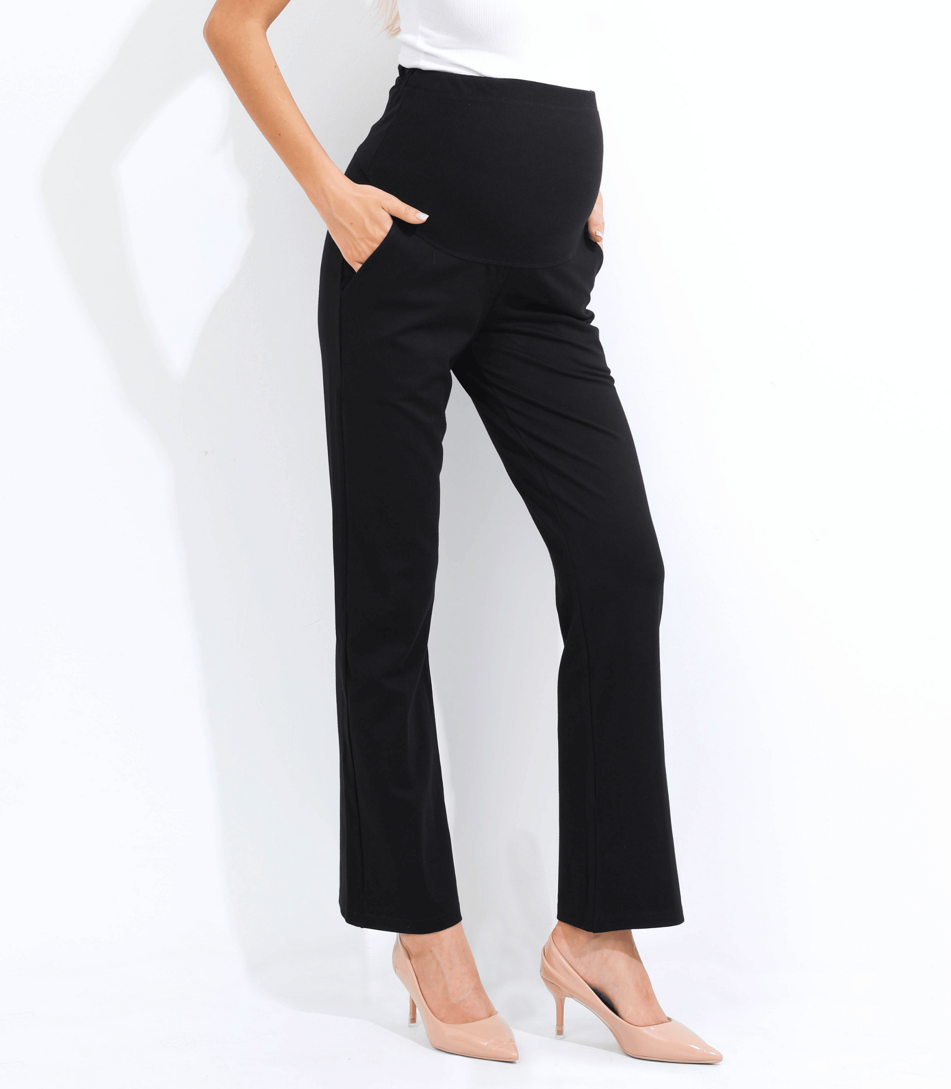 Black pants worn by a person on a white background