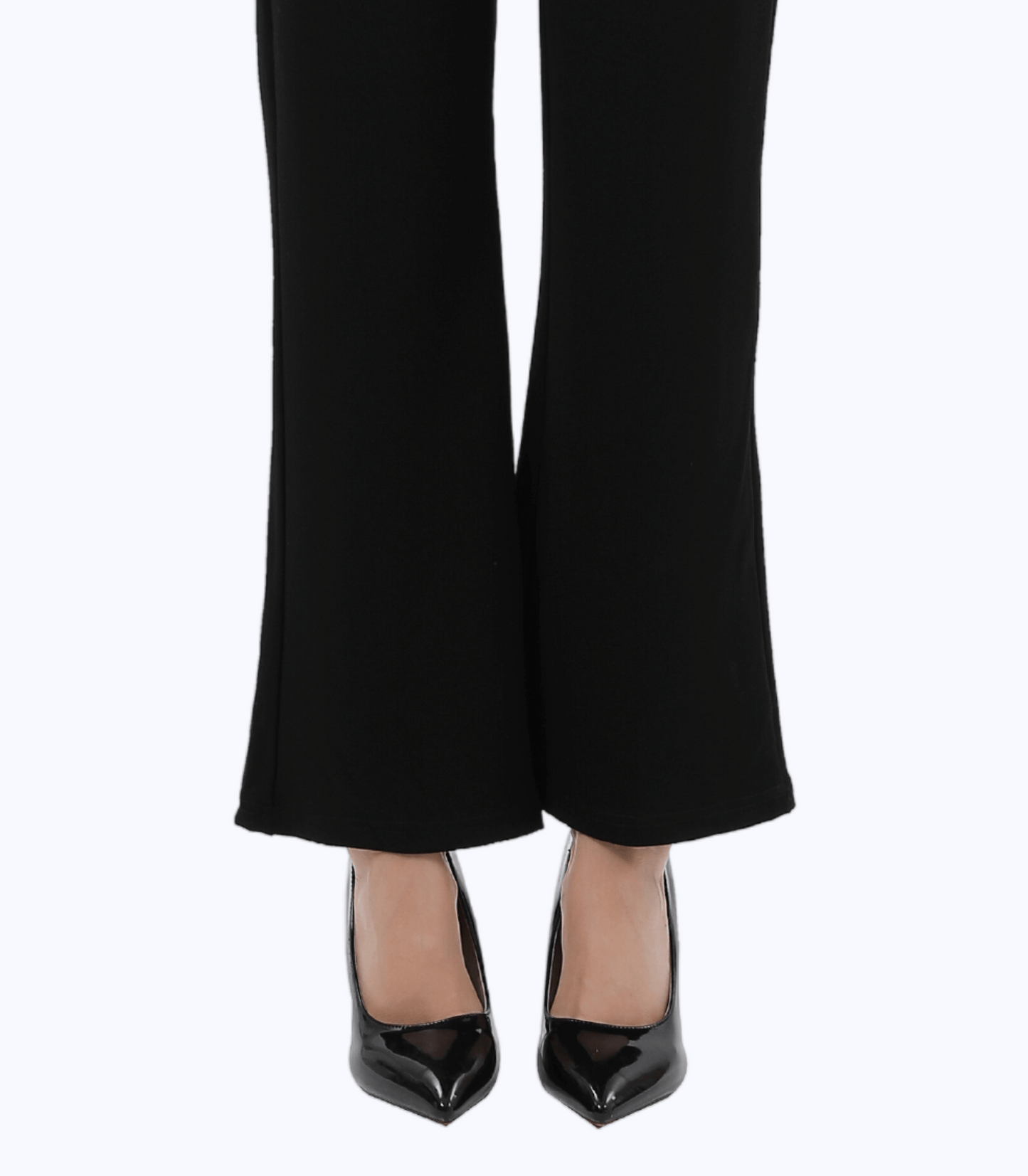 Black pants worn by a person on a white background