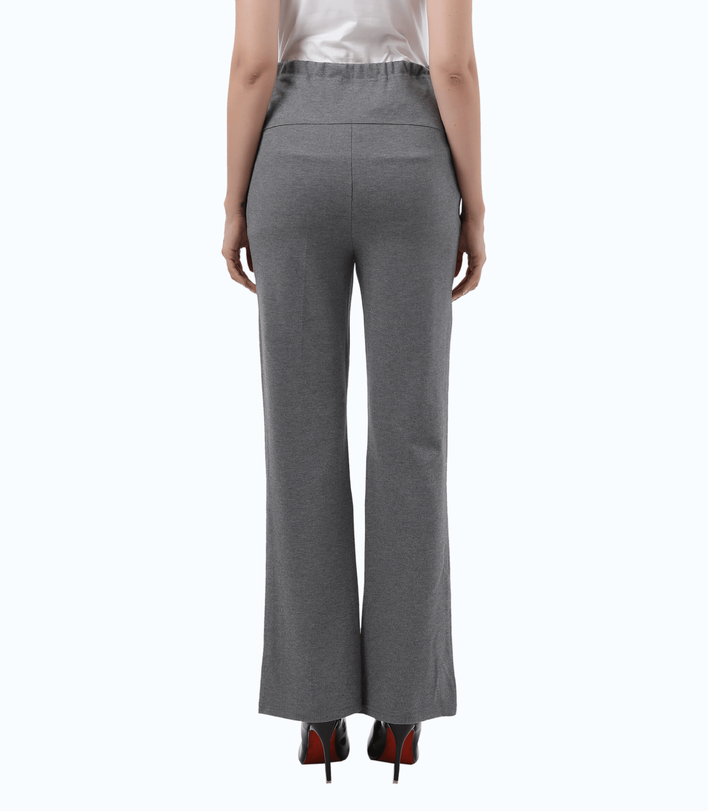 Gray pants worn by a person on a white background