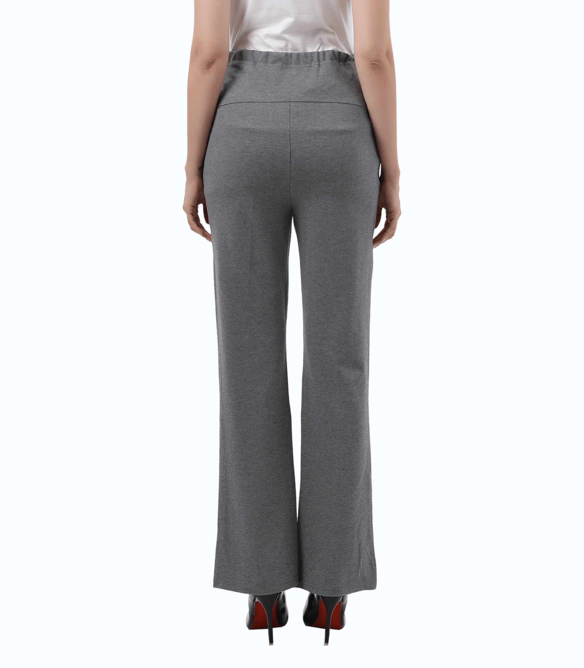 Gray pants worn by a person on a white background