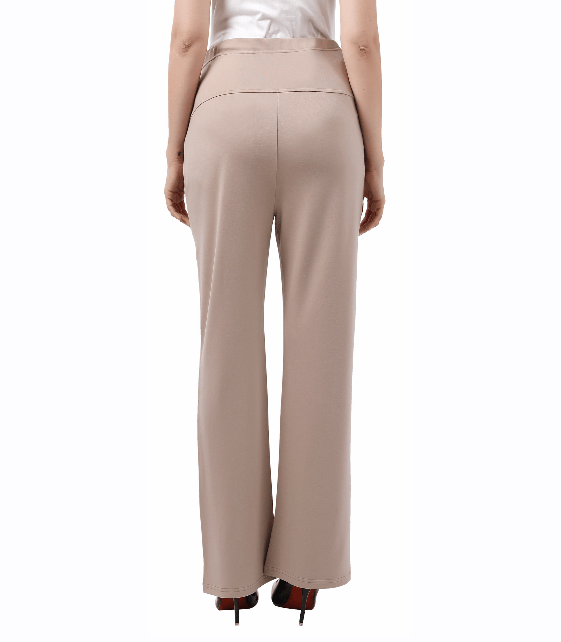 Beige pants worn by a person on a white background