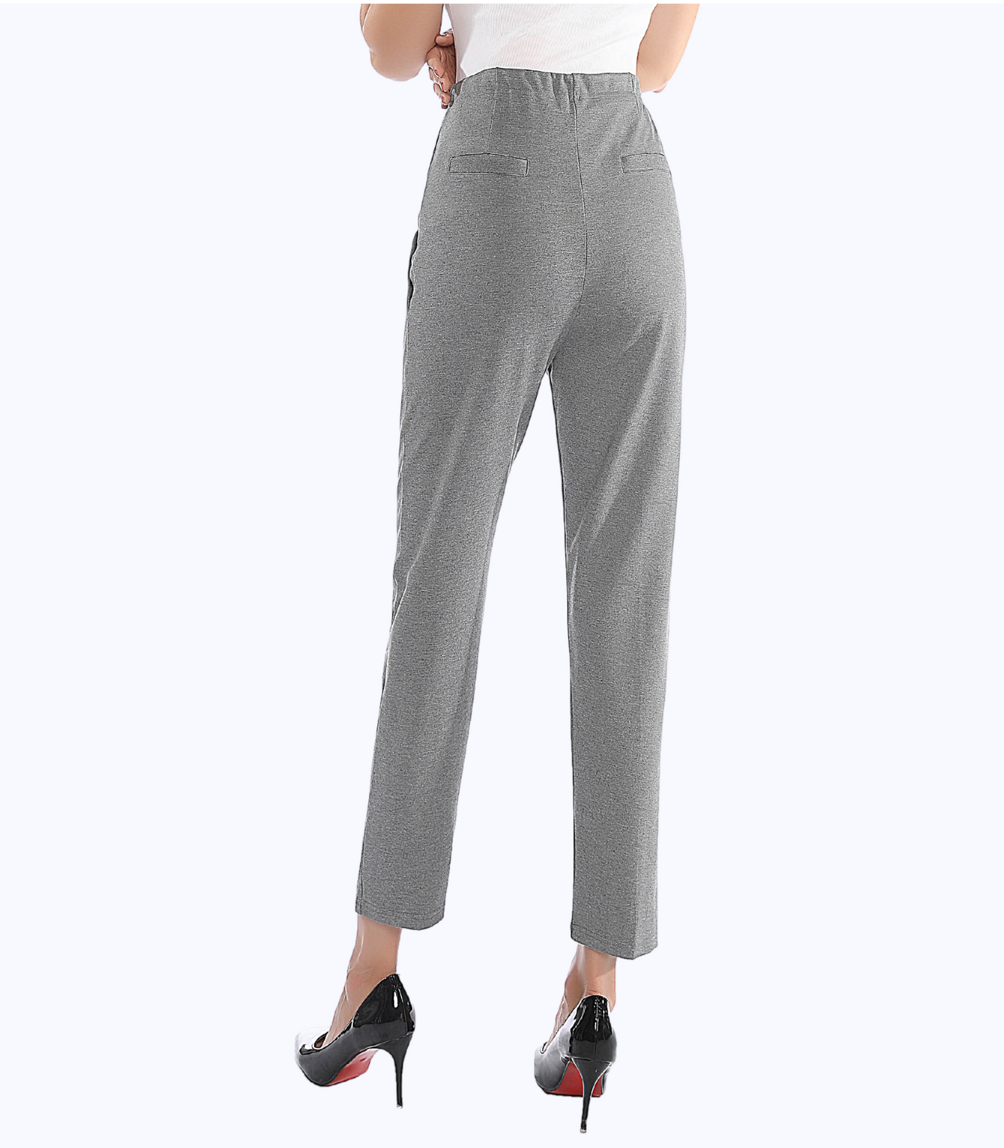 Gray pants worn by a person on a white background