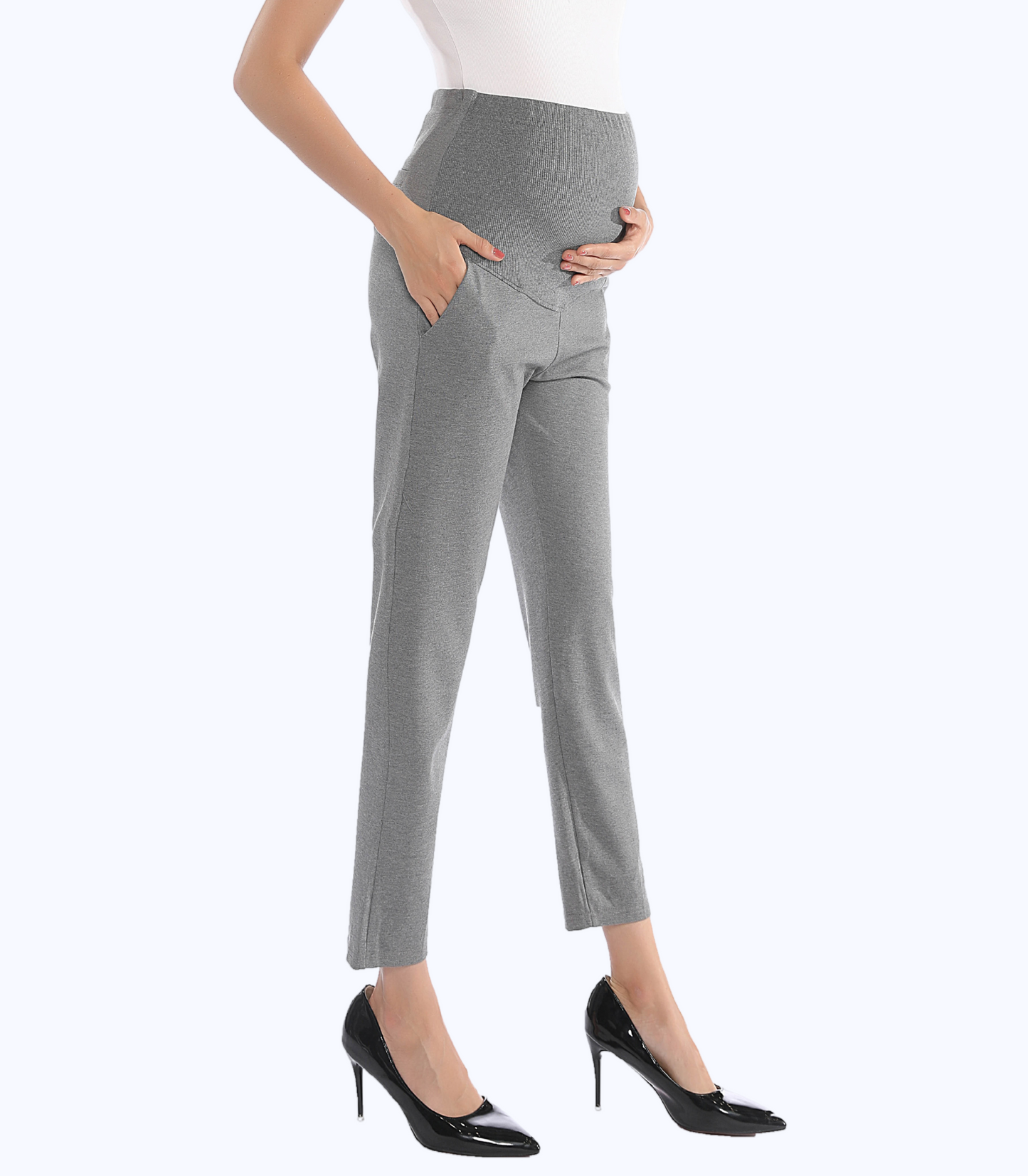 Gray pants worn by a person on a white background