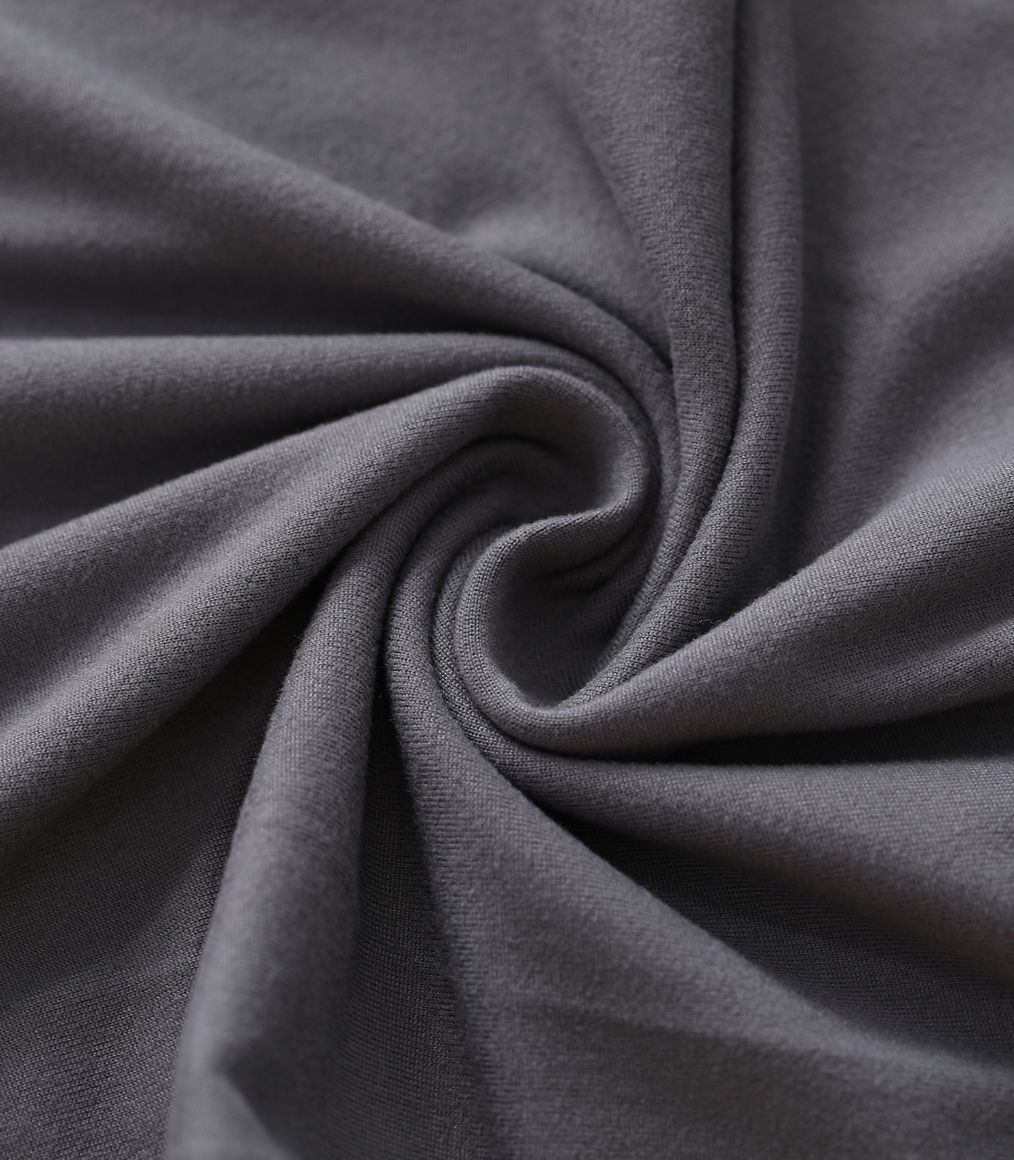 Close-up of dark gray fabric with folds