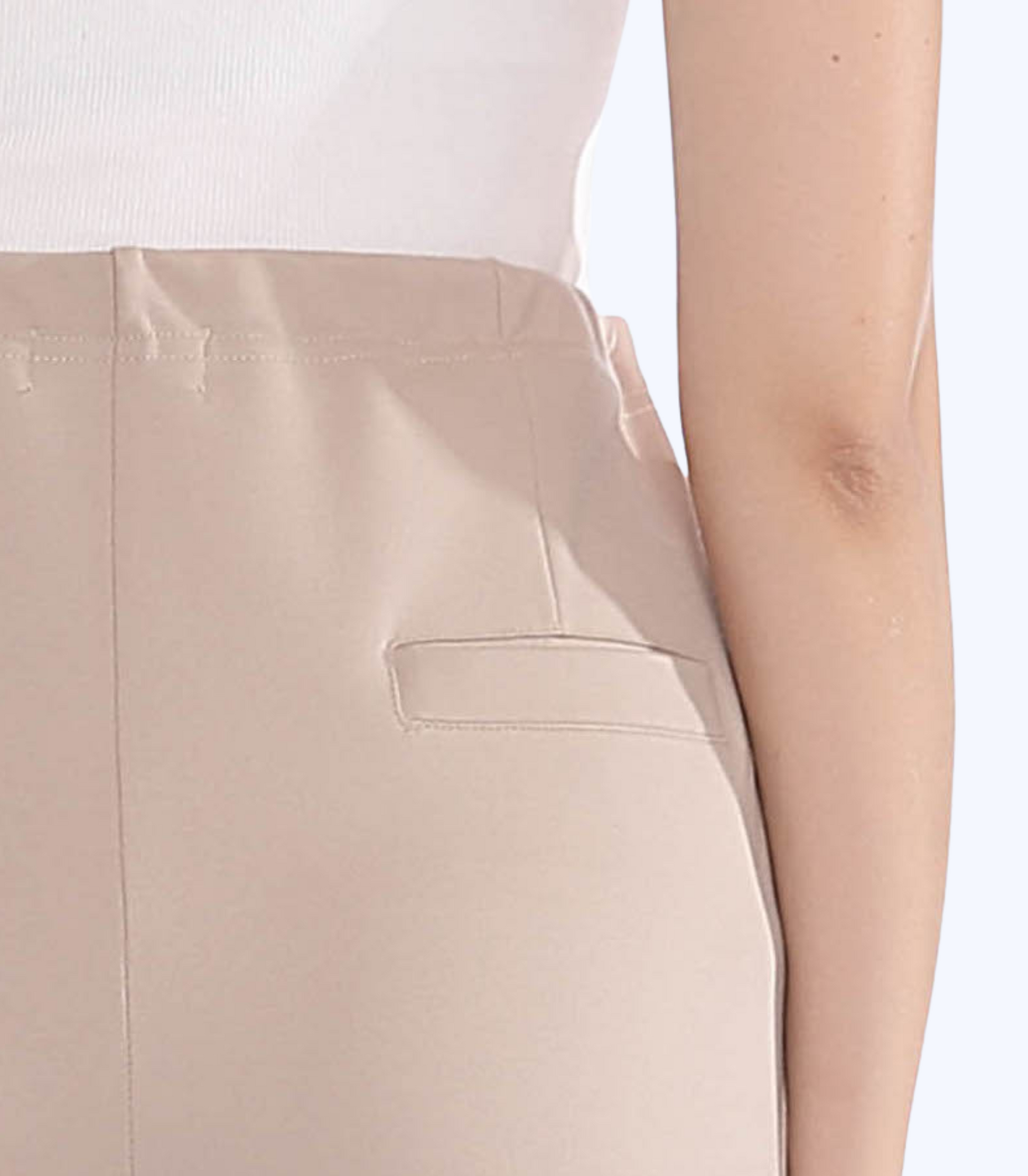 Beige pants with a pocket detail on a white background
