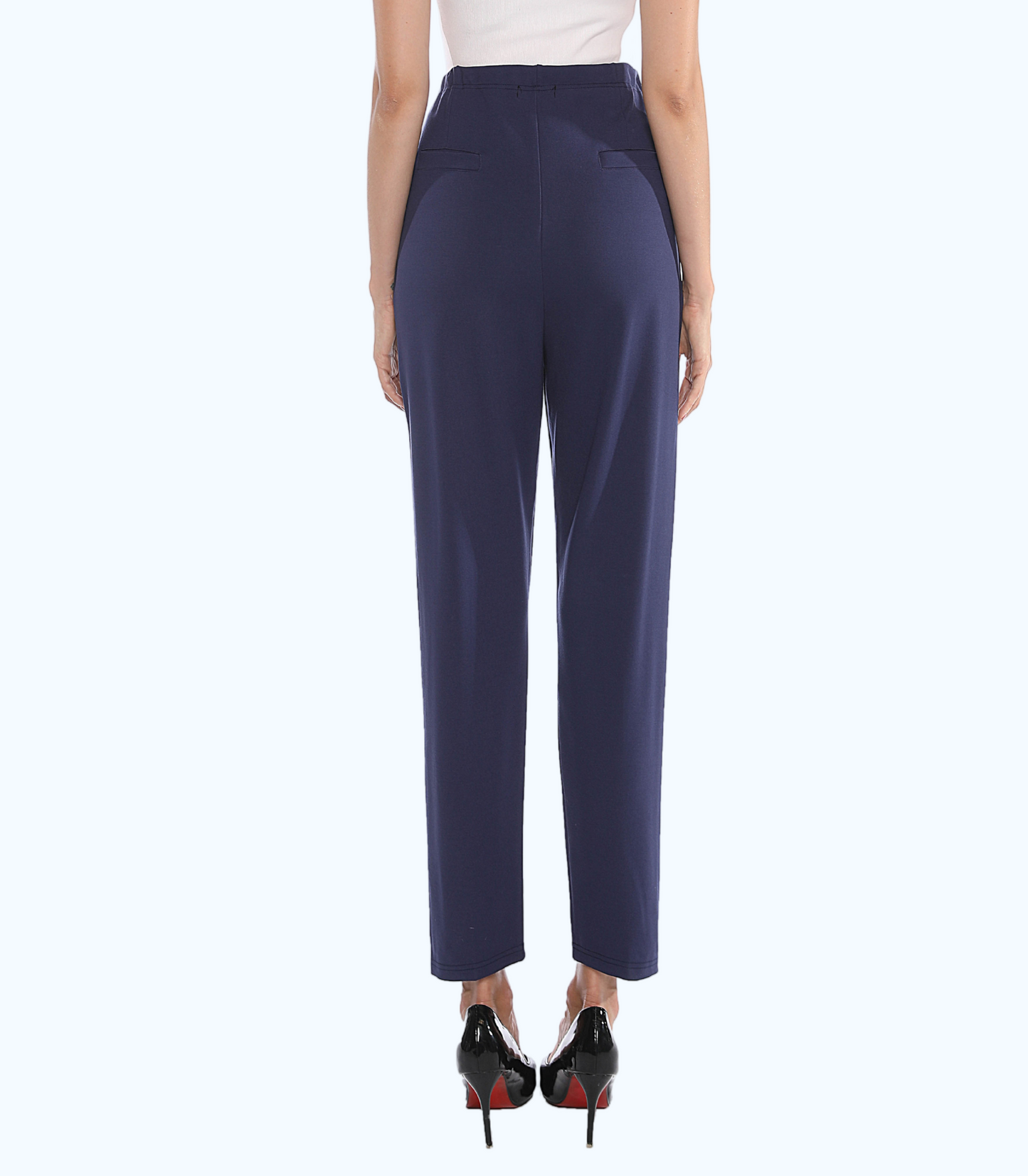 Navy blue pants worn by a person on a white background